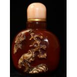 A SHADOW AGATE SNUFF BOTTLE, CIRCA 1900 Decorated with a pair of birds.