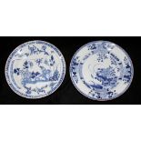 TWO 18TH CENTURY CHINESE EXPORT PORCELAIN BLUE AND WHITE PLATES Hand painted with a floral garden