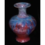 A LARGE FLAMBÉ VASE, CIRCA 1920 Wide shouldered form with a trumpet neck, the striking glaze with