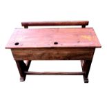 AN EARLY 20TH CENTURY FRENCH OAK CHILD DUET SCHOOL DESK.