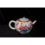 A KANGXI 'VERTE IMARI' TEAPOT AND COVER The bullet form body decorated in Japanese style with a