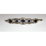 AN UNUSUAL WHITE METAL, AMETHYST AND SAPPHIRE BRACELET Set with a central oval cut amethyst, flanked