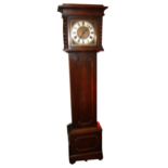 AN EARLY 20TH CENTURY OAK AND BRASS JACOBEAN STYLE LONGCASE CLOCK With barley twist supports and a