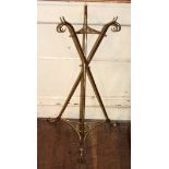 A 19TH CENTURY BRASS TRIPOD JARDINIÈRE STAND Scrolled finials and crossover style with lion paw