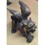 A LARGE BRONZE STATUE OF A MEDIEVAL GARGOYLE. (69cm x 62cm)