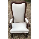 A VICTORIAN MAHOGANY OPEN ARMCHAIR In oatmeal fabric upholstery.