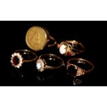 A COLLECTION OF VINTAGE 9CT GOLD DRESS RINGS Comprising two opal rings set with white sapphires