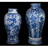 TWO KANGXI BLUE AND WHITE BALUSTER VASES Both with panelled decorations of flowers, the tallest vase