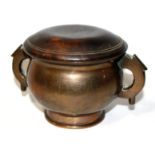 AN 18TH CENTURY SILVER INLAID BRONZE CENSER Of double handled archaic gui form, the polished metal
