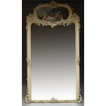 A LARGE 19TH CENTURY FRENCH PAINTED TRUMEAU WALL MIRROR Decorated with floral cresting above oval