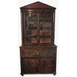 AN EARLY VICTORIAN FLAME MAHOGANY SECRÉTAIRE BOOKCASE With two glazed doors flanked by pillars above