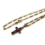 A VINTAGE 9CT GOLD DIAMOND AND GEM SET CRUCIFIX PENDANT The oval cut stones set with a single