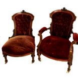 A PAIR OF VICTORIAN MAHOGANY FRAMED CHAIRS In red velvet button upholstery.