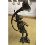 A LARGE BRONZE STATUE OF A PIXIE PLAYING A FRENCH HORN. (104cm)