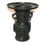 A LARGE MING BRONZE BEAKER VASE, CIRCA 1600 With black patination and double ring handles, the