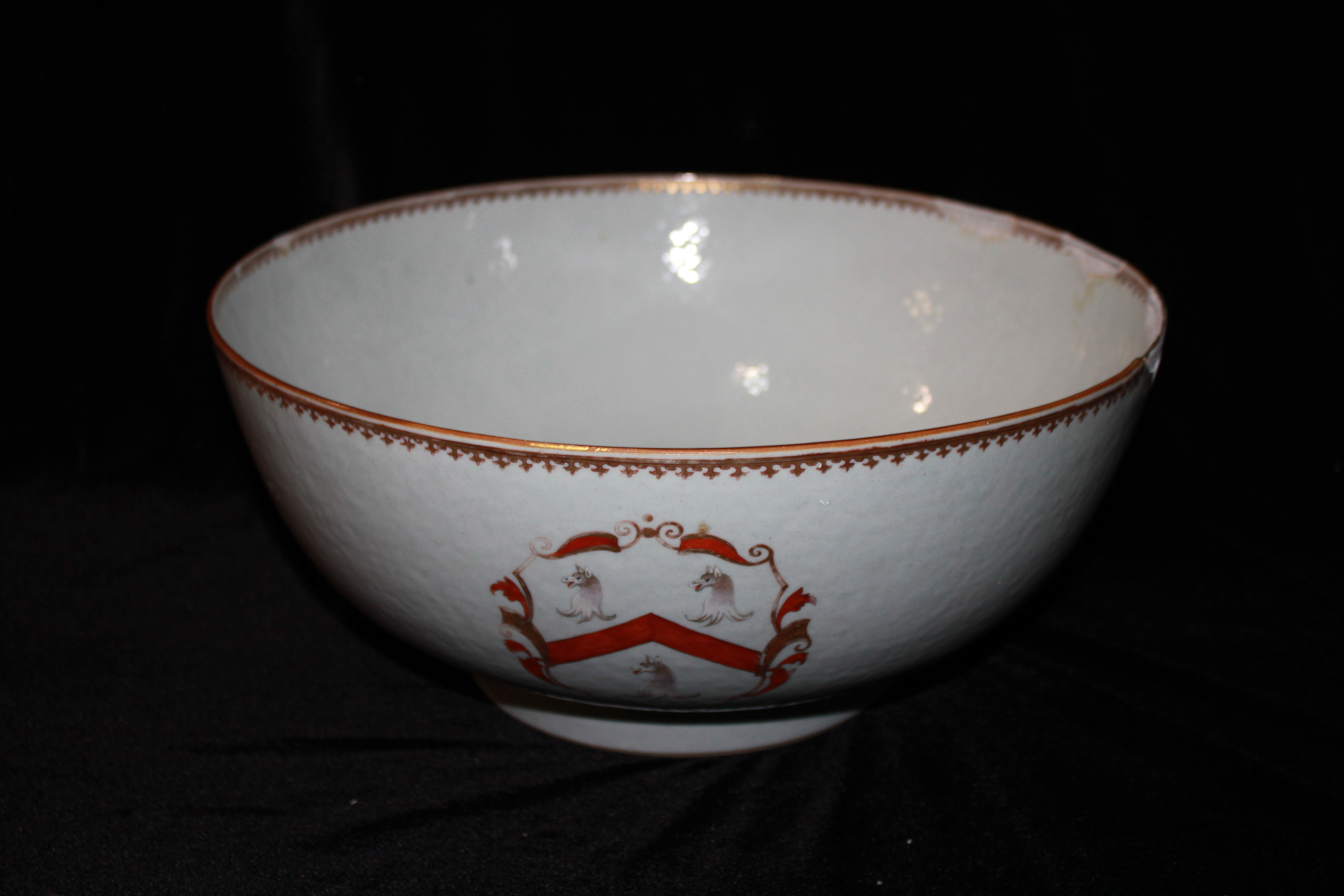 A LARGE 18TH CENTURY CHINESE ARMORIAL PORCELAIN PUNCH BOWL Hand painted with a family crest of a