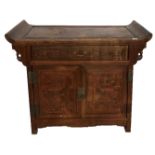 A 19TH CENTURY CHINESE HARDWOOD SIDE CABINET The scroll ends above one long drawer and cupboards. (