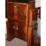 AN EARLY 20TH CENTURY WALNUT VENEERED COCKTAIL CABINET Having a rise and hinged Iid with fitted