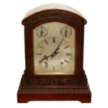 WINTERHALDER & HOFMIER, A LATE 19TH/ EARLY 20TH CENTURY OAK BRACKET CLOCK Having an arched top,