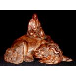 AN ANTIQUE CHINESE TERRACOTTA POTTERY FIGURAL GROUP OF A SEATED BUDDHA Wearing a long robe, seated