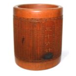 A 19TH CENTURY CHINESE BAMBOO BRUSH POT Decorated with lines of calligraphy. (d 13cm x h 14cm)