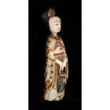 AN IVORY SNUFF BOTTLE FORMED AS A COURT LADY, CIRCA 1900 Bearing a four character Qianlong mark, the
