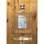 A 1930'S SHOPS DISPLAY BOTTLE OF FRENCH COLOGNE. (23cm)