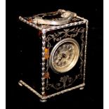 AN EDWARDIAN TORTOISESHELL AND SILVER MINIATURE CARRIAGE CLOCK Having a silver handle and a