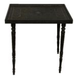 A 19TH CENTURY ANGLO-INDIAN CARVED EBONY CAMPAING TABLE The square top carved with foliage