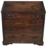 AN 18TH CENTURY SOLID MAHOGANY BUREAU The fall front opening to reveal a fitted interior above