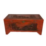 A PAINTED CARVED ORIENTAL CHEST Fitted with a brass lock plate.