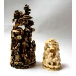 TWO SMALL IVORY MOUNTAINS, CIRCA 1800 Both carved with figures among rock work and pines. Condition: