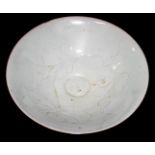 A THINLY POTTED WHITE GLAZED BOWL With incised decoration of peonies.