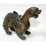 AN 18TH/19TH CENTURY CHINESE BRONZE SCROLL WEIGHT OF A KYLIN. (w 7cm)