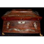 A 19TH CENTURY ROSEWOOD SEWING BOX With foliate mother of pearl inlay, raised on gilt metal lion paw