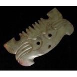 AN ARCHAISTIC GREEN JADE PLAQUE FORMED AS A MASK, CIRCA 1880 Carved with a beast face. Condition: