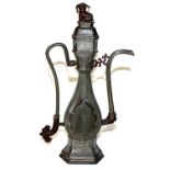 AN ELONGATED ISLAMIC SHAPE PEWTER EWER AND COVER, CIRCA 1800 Of flattened hexagonal section, with