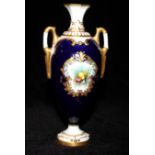ROYAL WORCESTER, AN EARLY 20TH CENTURY PORCELAIN BALUSTER VASE With twin gilt handles, blue ground