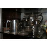 A COLLECTION OF VICTORIAN AND LATER PEWTER AND SILVER PLATED WARE Comprising a large coffee pot with