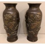 A PAIR OF 19TH CENTURY JAPANESE MEIJI BRONZE BALUSTER VASES With relief decoration of birds and