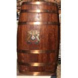 AN OAK AND COPPER BOUND BARREL WITH ARMORIAL CREST