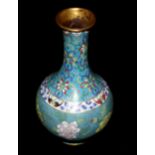 A CLOISONNÉ BOTTLE VASE, CIRCA 1850 The globular body decorated with peonies on a turquoise