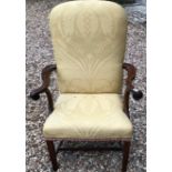 A GEORGIAN MAHOGANY OPEN ARMCHAIR With upholstered seat and back and scrolling arms, raised on