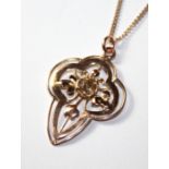 AN EARLY 20TH CENTURY 9CT ROSE GOLD AND DIAMOND PENDANT The single round cut diamond held in an