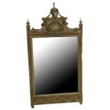 A 19TH CENTURY ADAMS DESIGN MIRROR Crested with an urn above an oval plaque with rams heads above