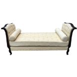 A 19TH CENTURY STYLE FRENCH DAYBED With scroll ends and button back lemon fabric upholstery, raised