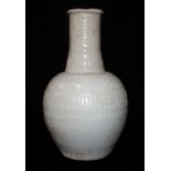 A QINGBAI SONG/YUAN DYNASTY BOTTLE VASE Having a tall neck, decorated with impressed bands of