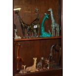 A COLLECTION OF STATUES OF GIRAFFES Glass, ceramic and metal, including Orrefors.