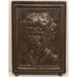 A 19TH CENTURY CONTINENTAL BRONZE PORTRAIT PLAQUE Cast as a young gentleman, having an easel