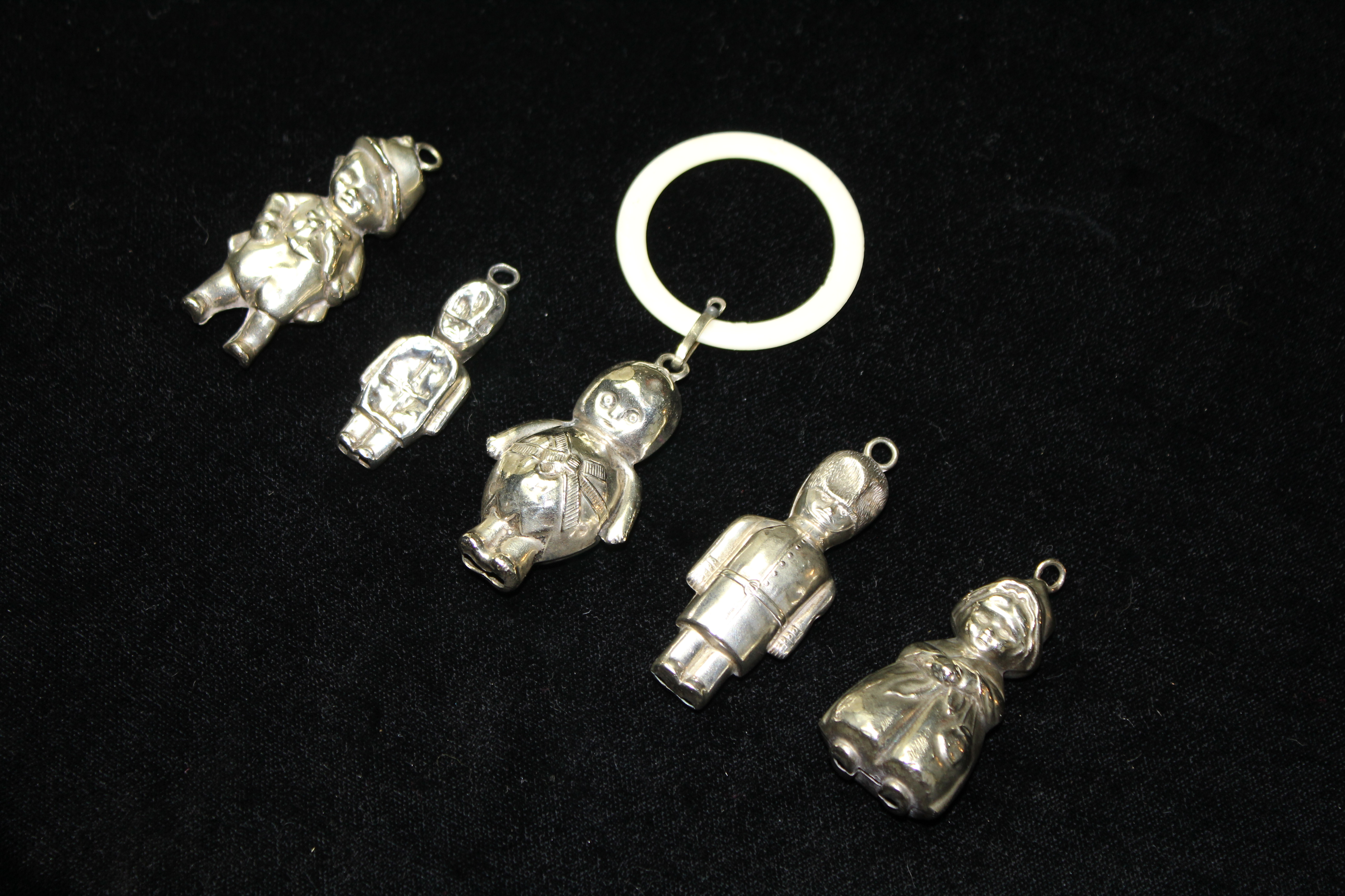 TWO EDWARDIAN SILVER AND IVORY CHILD'S BELL FORM RATTLES/TEETHING RINGS Engraved declaration,